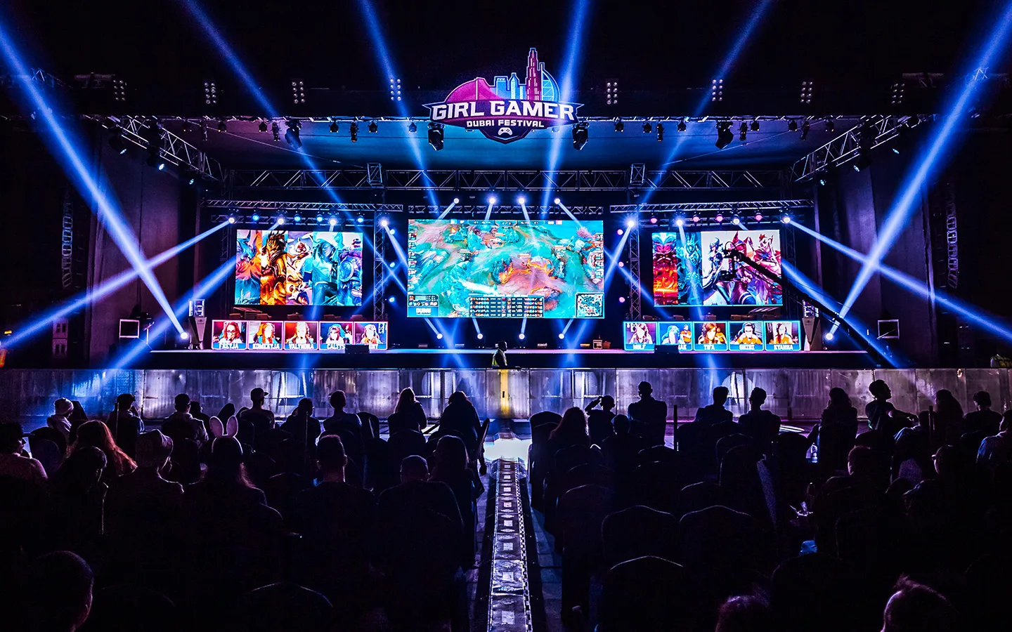 The GIRLGAMER Esports Festival main stage in Dubai, lit up in front of a live crowd